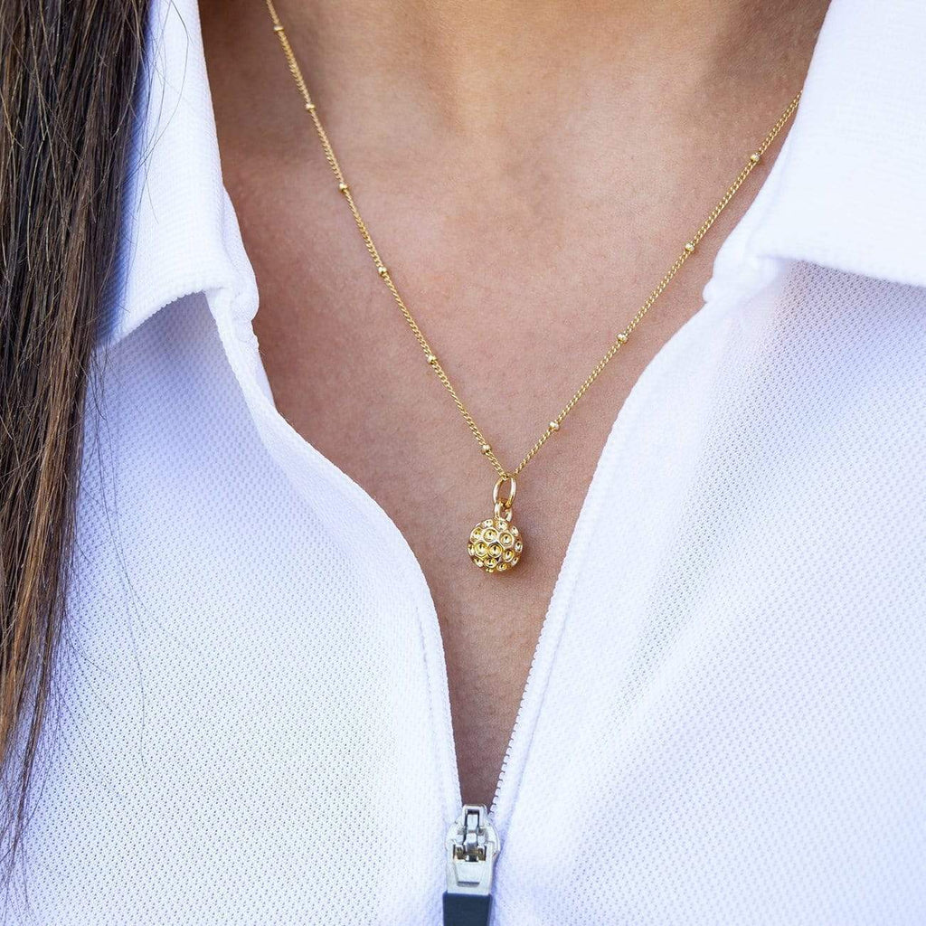 Golf Goddess gold golf ball necklace by Chelsea Charles