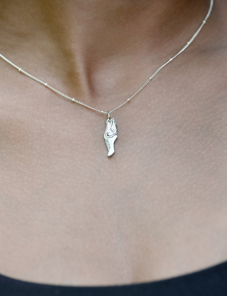 CC Sport Silver Track and Field Necklace with winged running shoe 