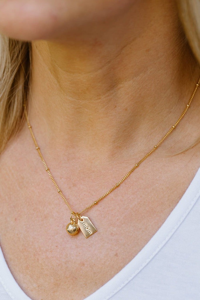 Gold Baseball Mom Necklace close up of model wearing
