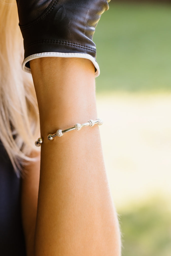 Golf Goddess silver score counter bracelet on wrist