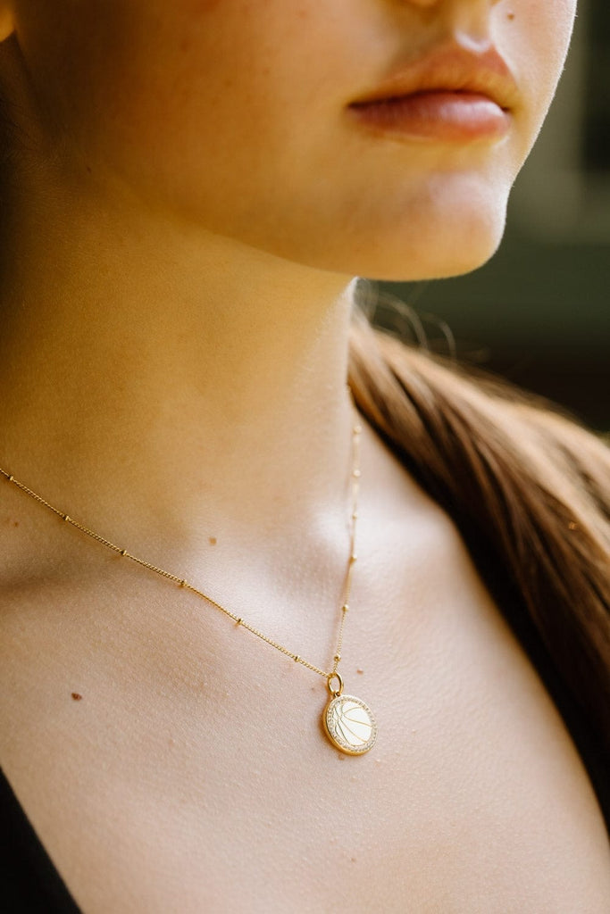 Basketball charm necklace with clear pavé crystals by Chelsea Charles