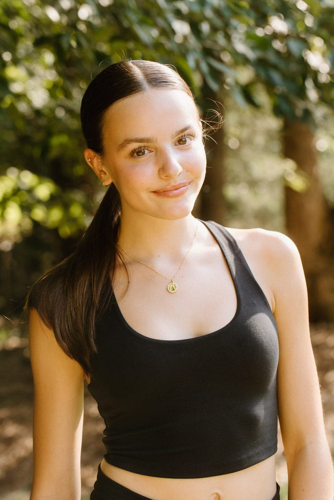 Gold softball necklace with pavé crystals by Chelsea Charles