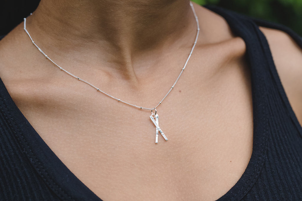 Chelsea Charles silver ski necklace 