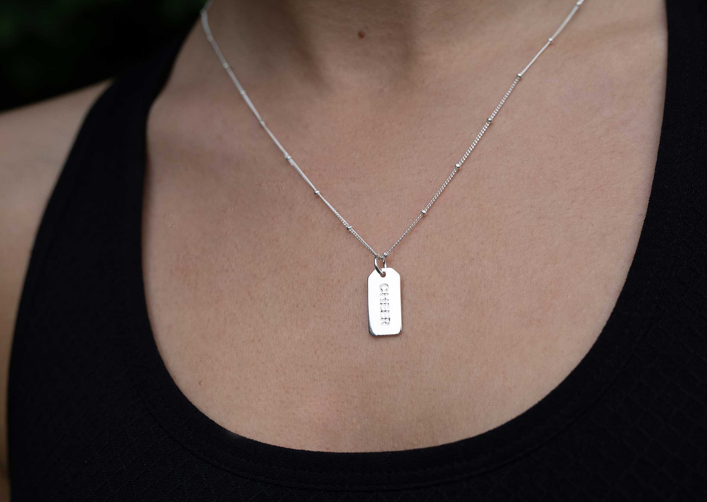 Reversible Silver Cheer Charm Necklace by Chelsea Charles