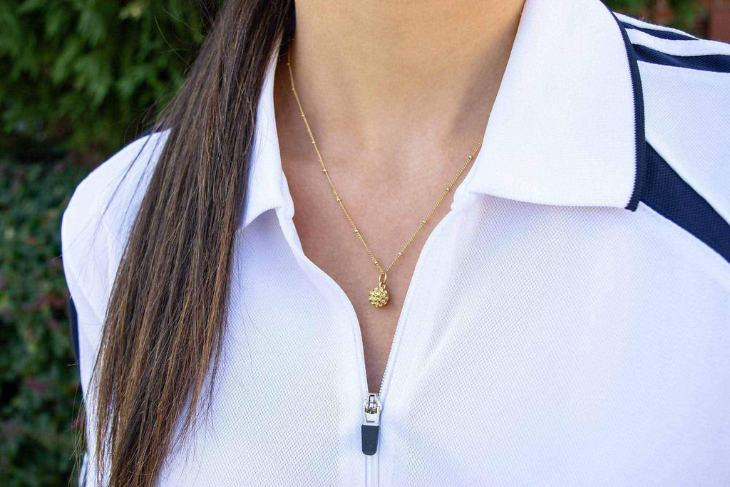 Golf Goddess gold golf ball necklace by Chelsea Charles